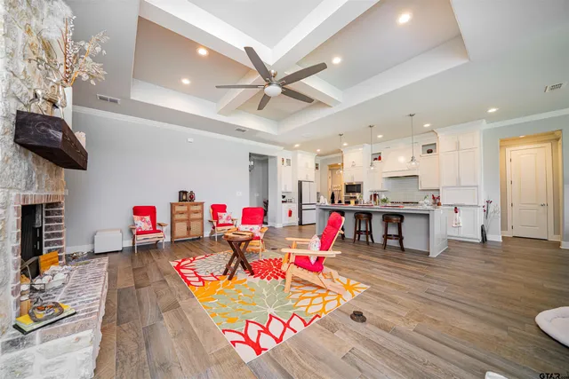 a living room with furniture and kitchen view