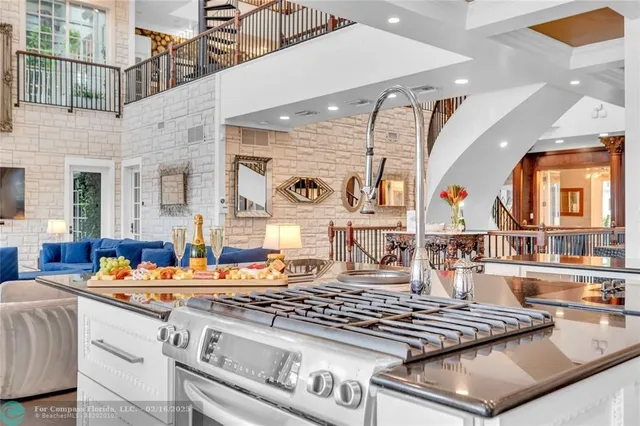 a kitchen with stainless steel appliances granite countertop a sink and cabinets