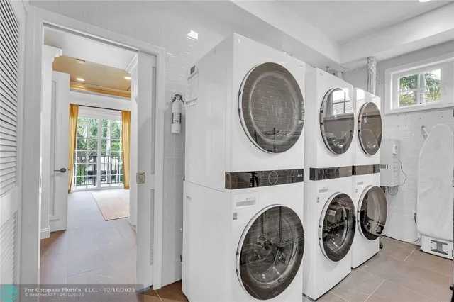 a view of a storage & utility room with washer and dryer