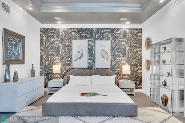 a bedroom with a large bed and a couch