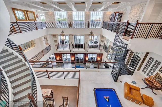 a view of entryway livingroom and hall with wooden floor