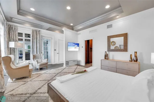 a bedroom with a large bed and furniture