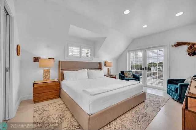 a bedroom with a large bed and a couch