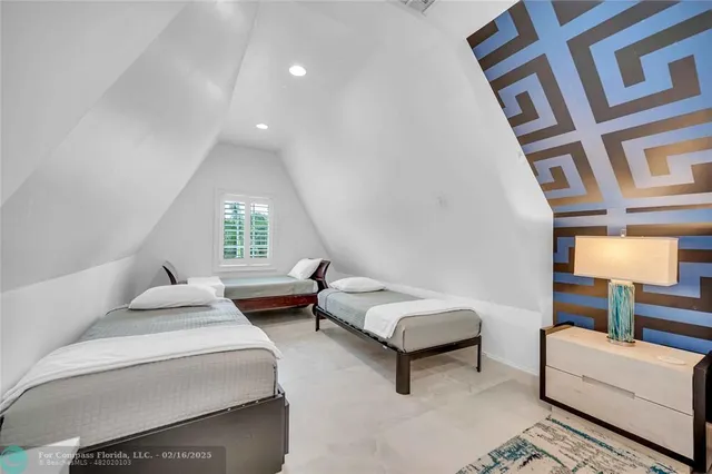 a bedroom with furniture and a window