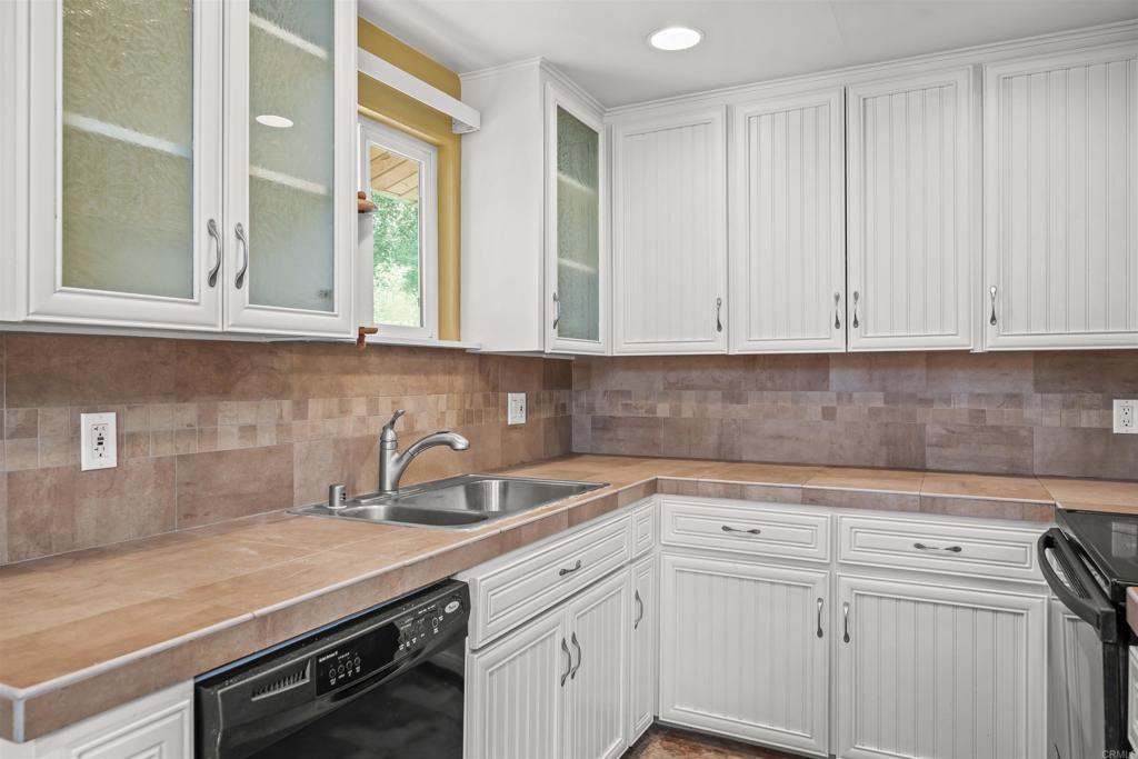 29131 Half Moon Trail Pine Valley, CA 91962 - Photo 19 of 50 a kitchen with a sink and cabinets