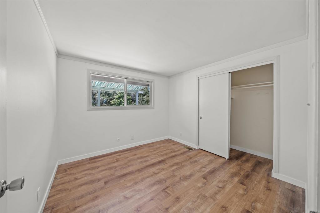29131 Half Moon Trail Pine Valley, CA 91962 - Photo 22 of 50 a view of empty room with window and wooden floor