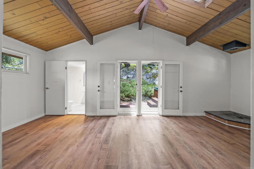 29131 Half Moon Trail Pine Valley, CA 91962 - Photo 23 of 50 a view of an empty room with wooden floor and a window
