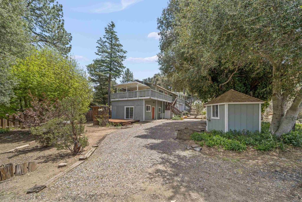 29131 Half Moon Trail Pine Valley, CA 91962 - Photo 43 of 50 a front view of a house with a garden