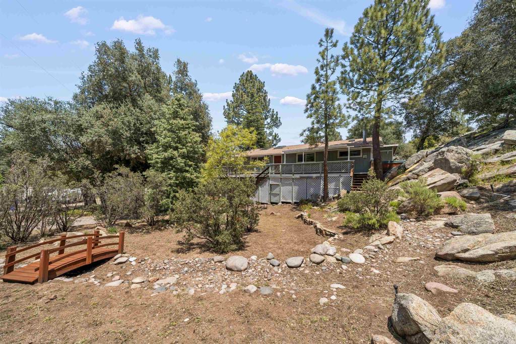 29131 Half Moon Trail Pine Valley, CA 91962 - Photo 5 of 50 a view of a backyard with wooden fence and trees