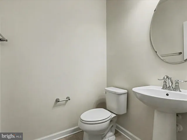 a bathroom with a toilet and a sink