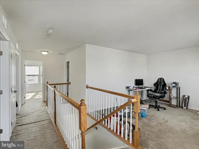a view of a hallway with workspace
