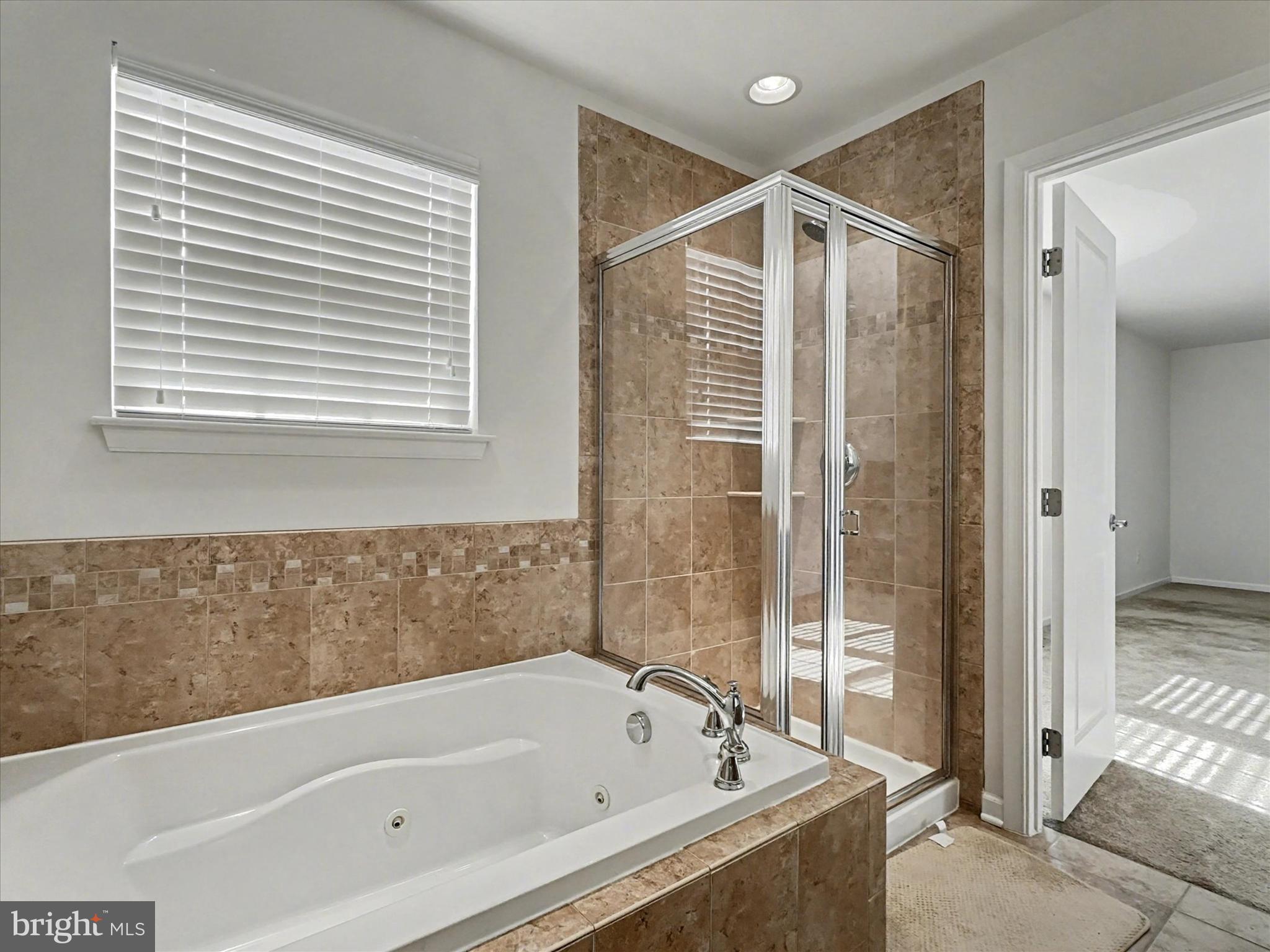 813 Countryside Road Seven Valleys, PA 17360 - Photo 20 of 38 a bathroom with a bathtub and a shower