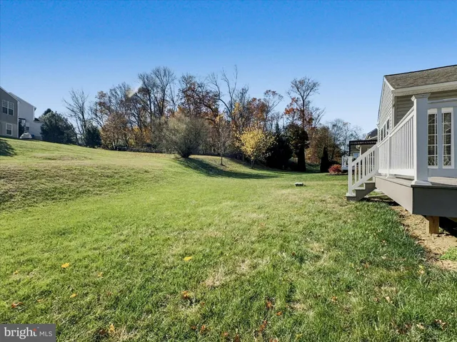 a front view of house with yard and seating area