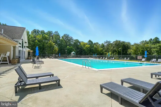 a view of a swimming pool with an outdoor space