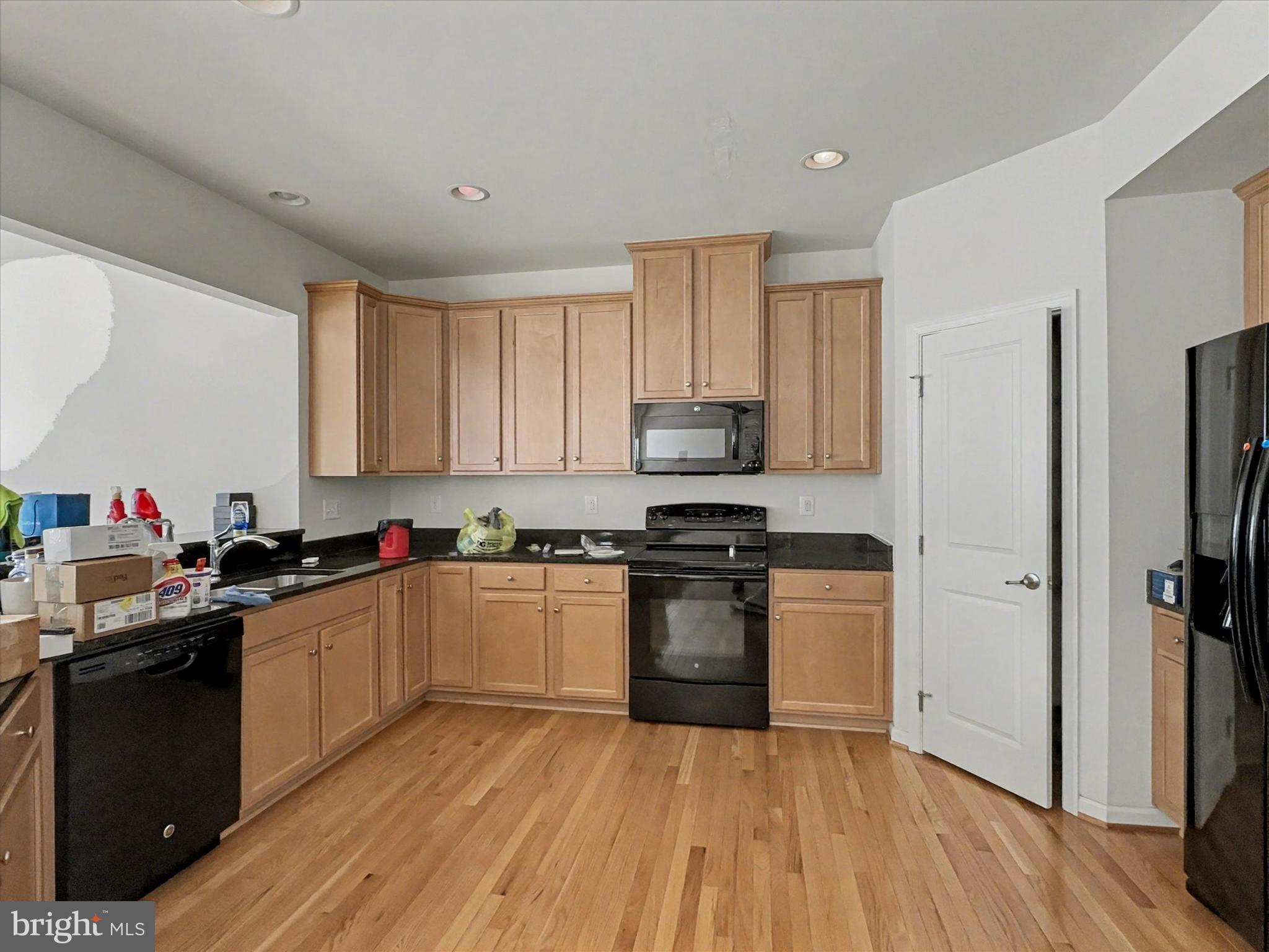 813 Countryside Road Seven Valleys, PA 17360 - Photo 10 of 38 a kitchen with granite countertop a refrigerator stove top oven and sink