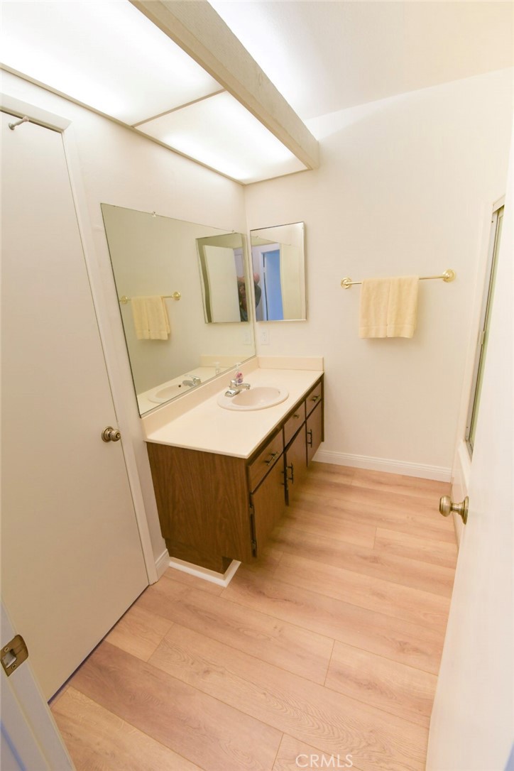 22346 Harbor Ridge Lane, Unit 4 Torrance, CA 90502 - Photo 16 of 34 a bathroom with a tub sink and mirror