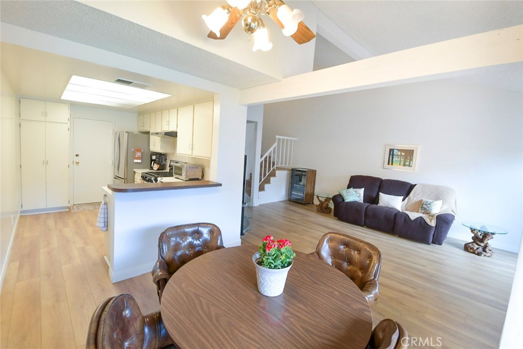 22346 Harbor Ridge Lane, Unit 4 Torrance, CA 90502 - Photo 30 of 34 a living room with furniture and a chandelier