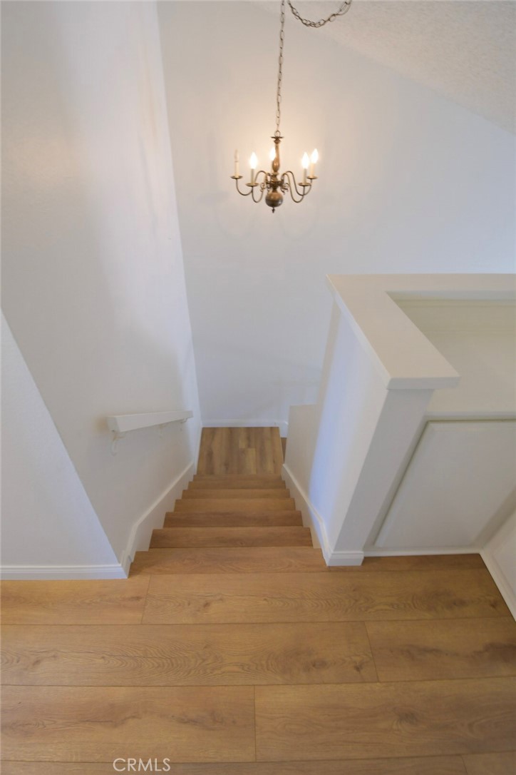 22346 Harbor Ridge Lane, Unit 4 Torrance, CA 90502 - Photo 32 of 34 a view of entryway and hall with a chandelier