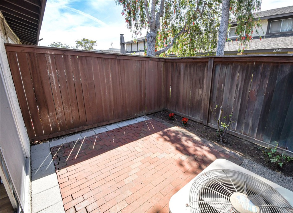 22346 Harbor Ridge Lane, Unit 4 Torrance, CA 90502 - Photo 33 of 34 a view of backyard with wooden fence and large trees