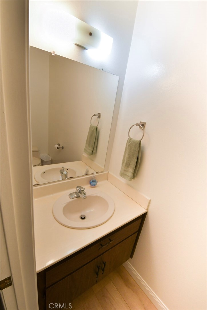 22346 Harbor Ridge Lane, Unit 4 Torrance, CA 90502 - Photo 6 of 34 a bathroom with a sink and a mirror