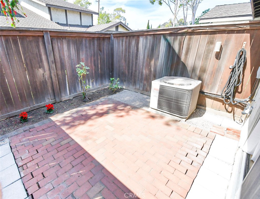 22346 Harbor Ridge Lane, Unit 4 Torrance, CA 90502 - Photo 7 of 34 a backyard of a house with table and chairs
