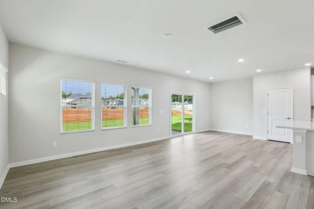 a view of staircase with lots of frames on wall and stairs