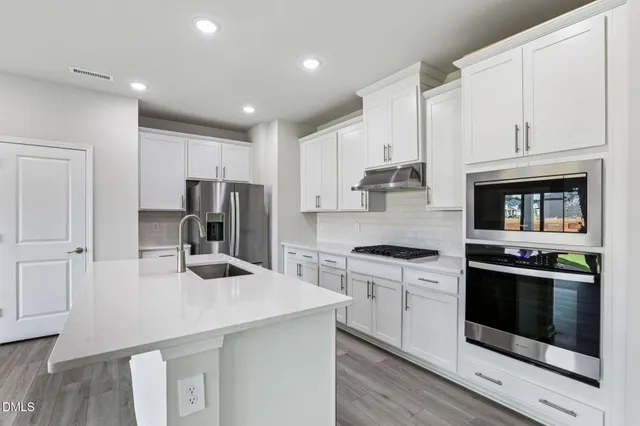 a view of kitchen with wooden floor