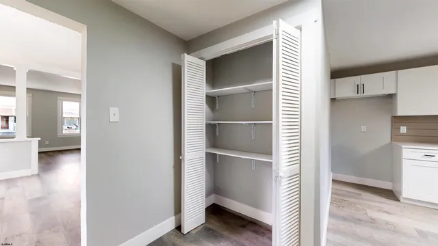 a view of kitchen space with a refrigerator
