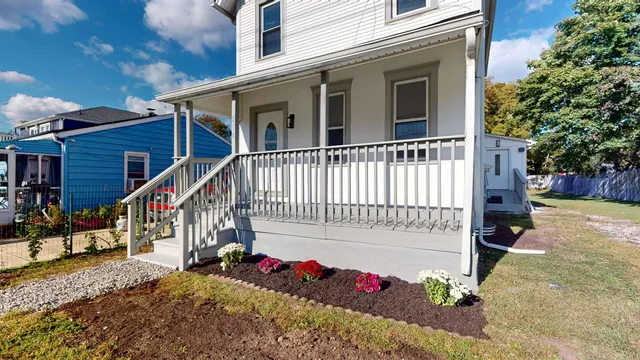 a view of a house with a small yard