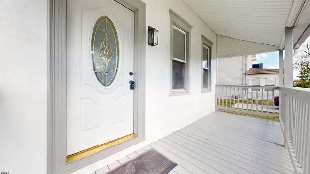 a view of a door with wooden floor