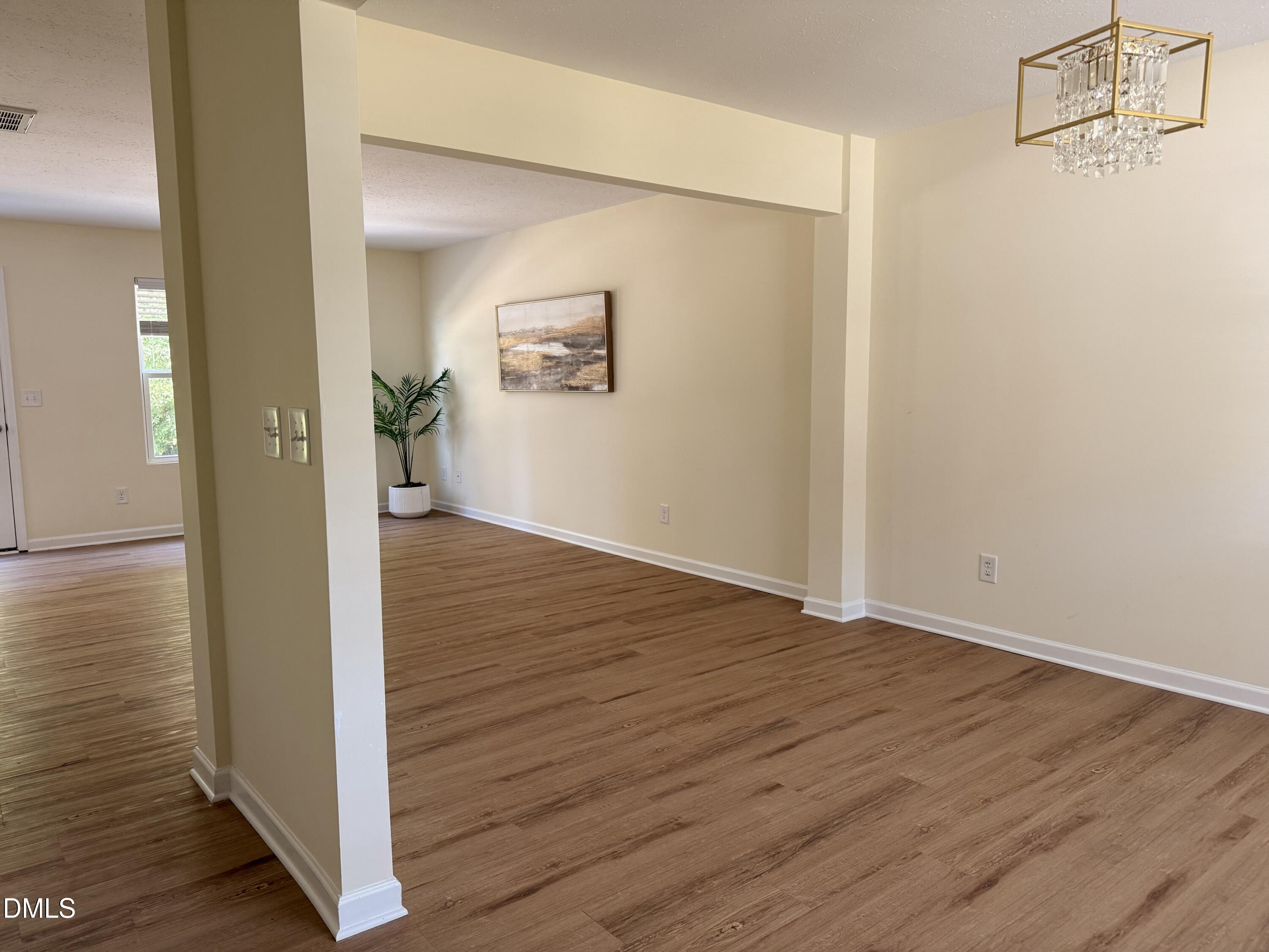 62 West Boulder Road Henderson, NC 27537 - Photo 12 of 34 a view of a hallway with wooden floor
