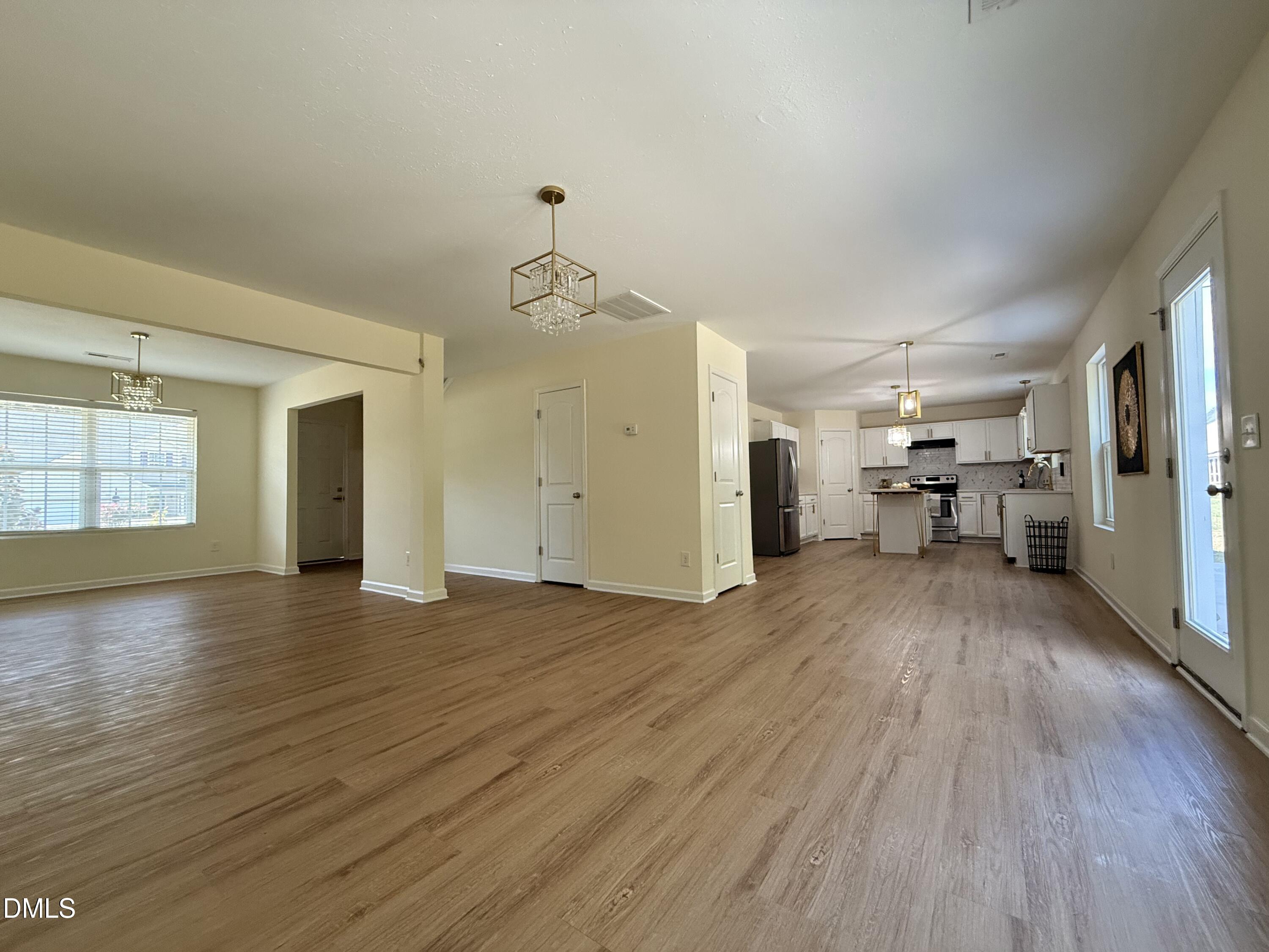 62 West Boulder Road Henderson, NC 27537 - Photo 15 of 34 a view of empty room with wooden floor