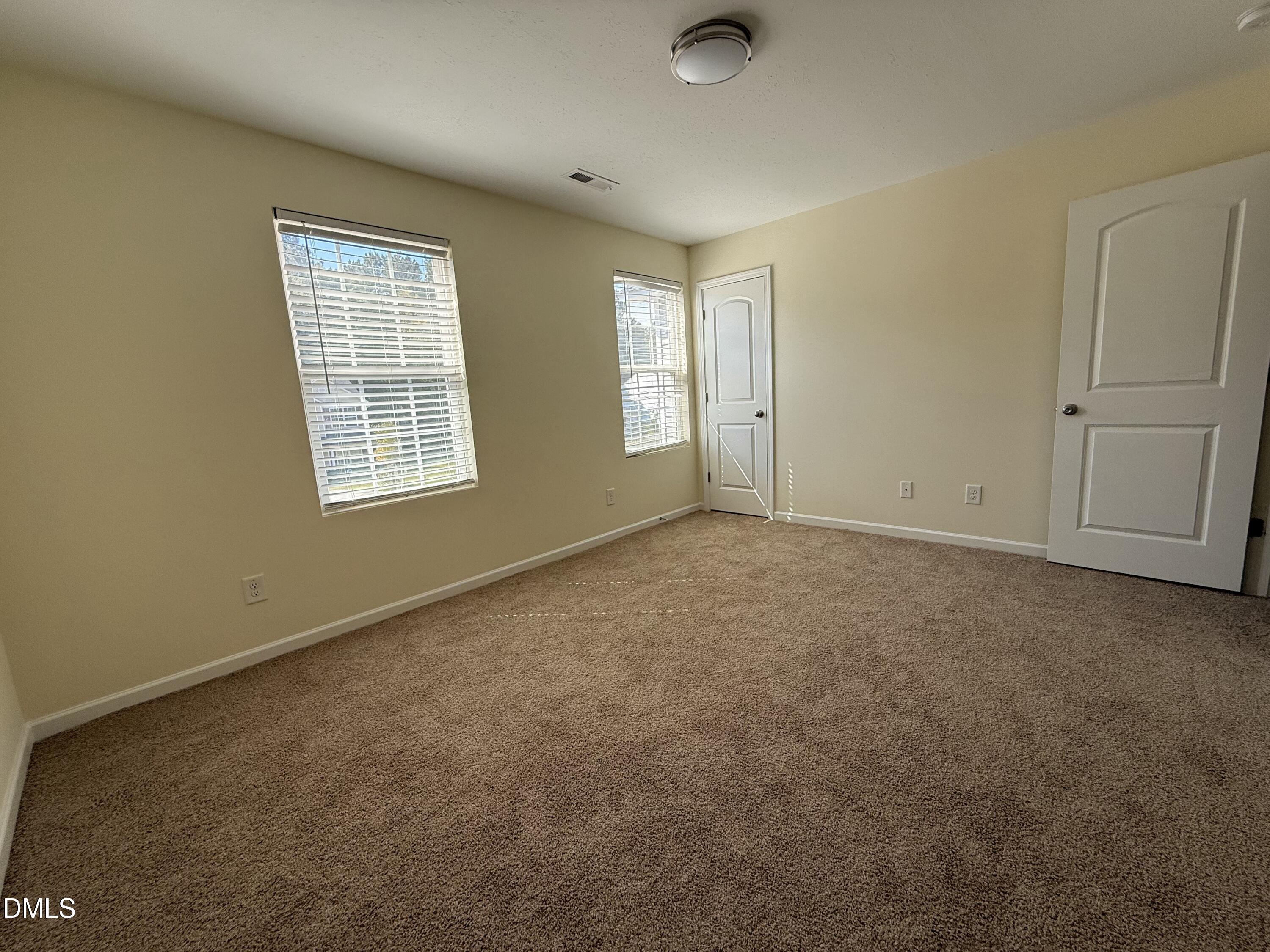62 West Boulder Road Henderson, NC 27537 - Photo 19 of 34 an empty room with windows