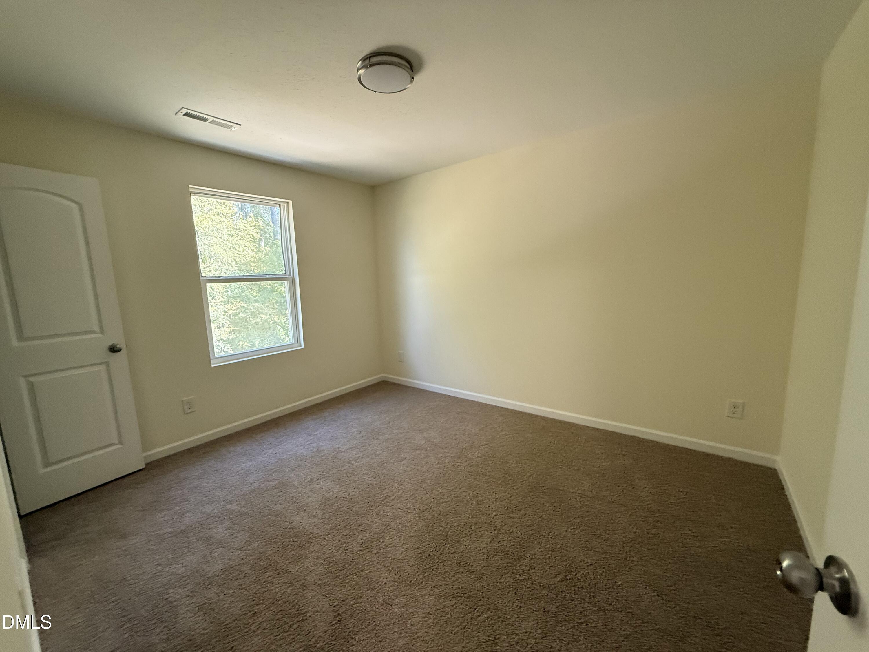 62 West Boulder Road Henderson, NC 27537 - Photo 21 of 34 an empty room with windows