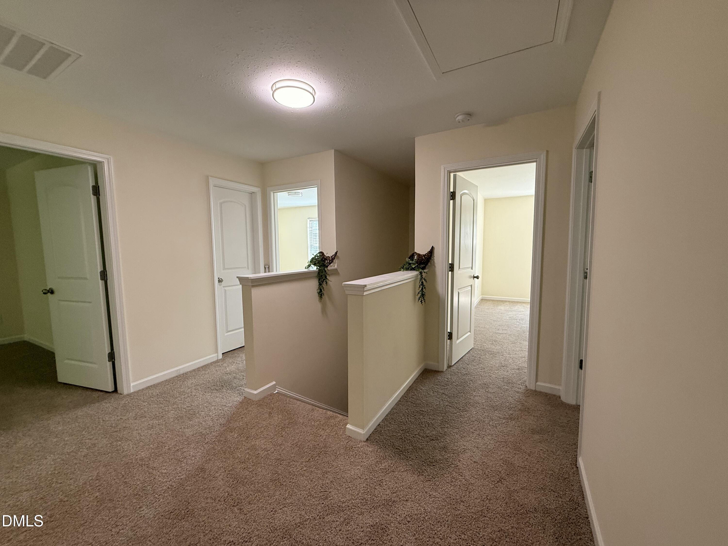 62 West Boulder Road Henderson, NC 27537 - Photo 24 of 34 an empty room with a door