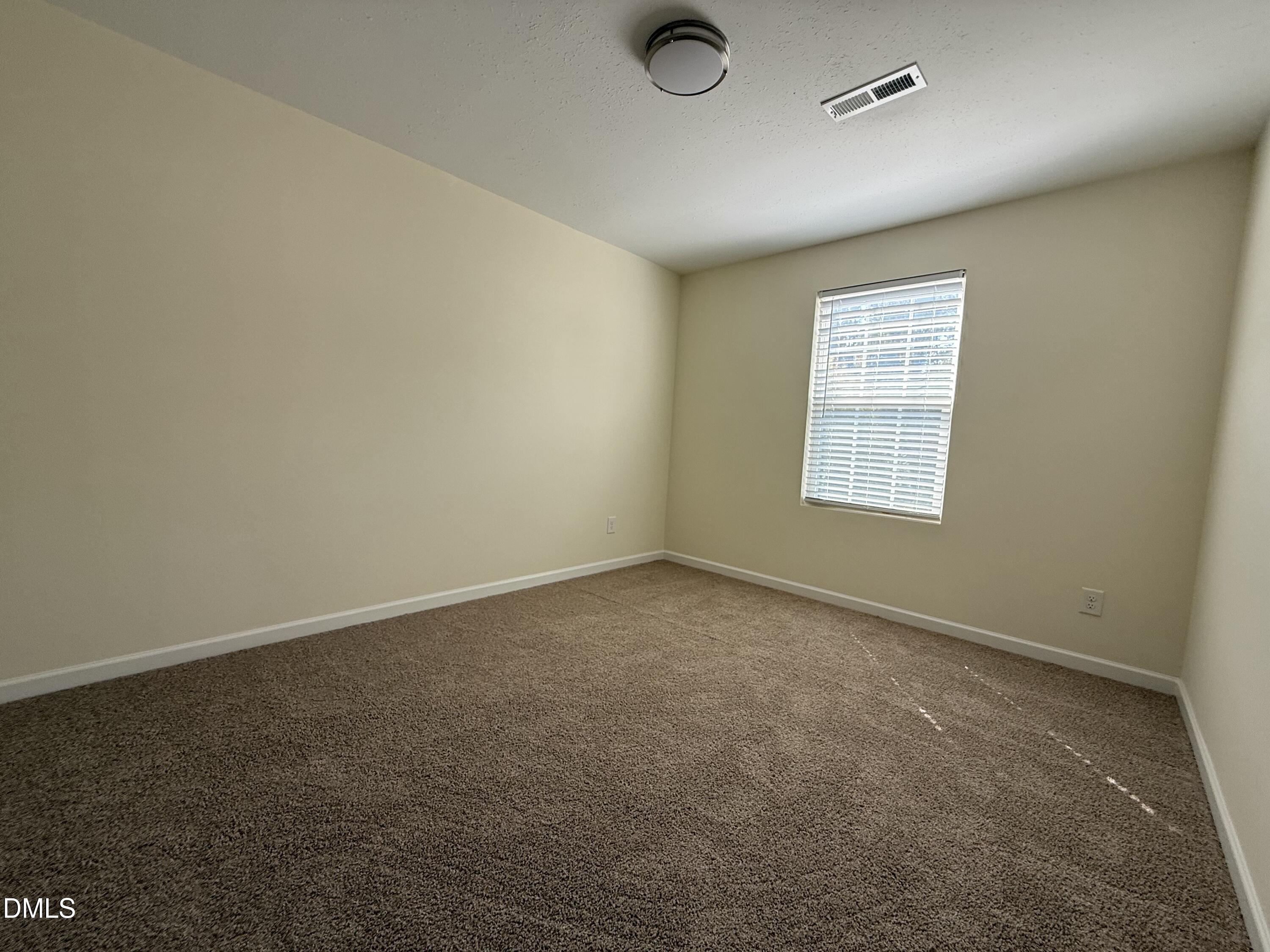 62 West Boulder Road Henderson, NC 27537 - Photo 25 of 34 an empty room with a empty space and windows