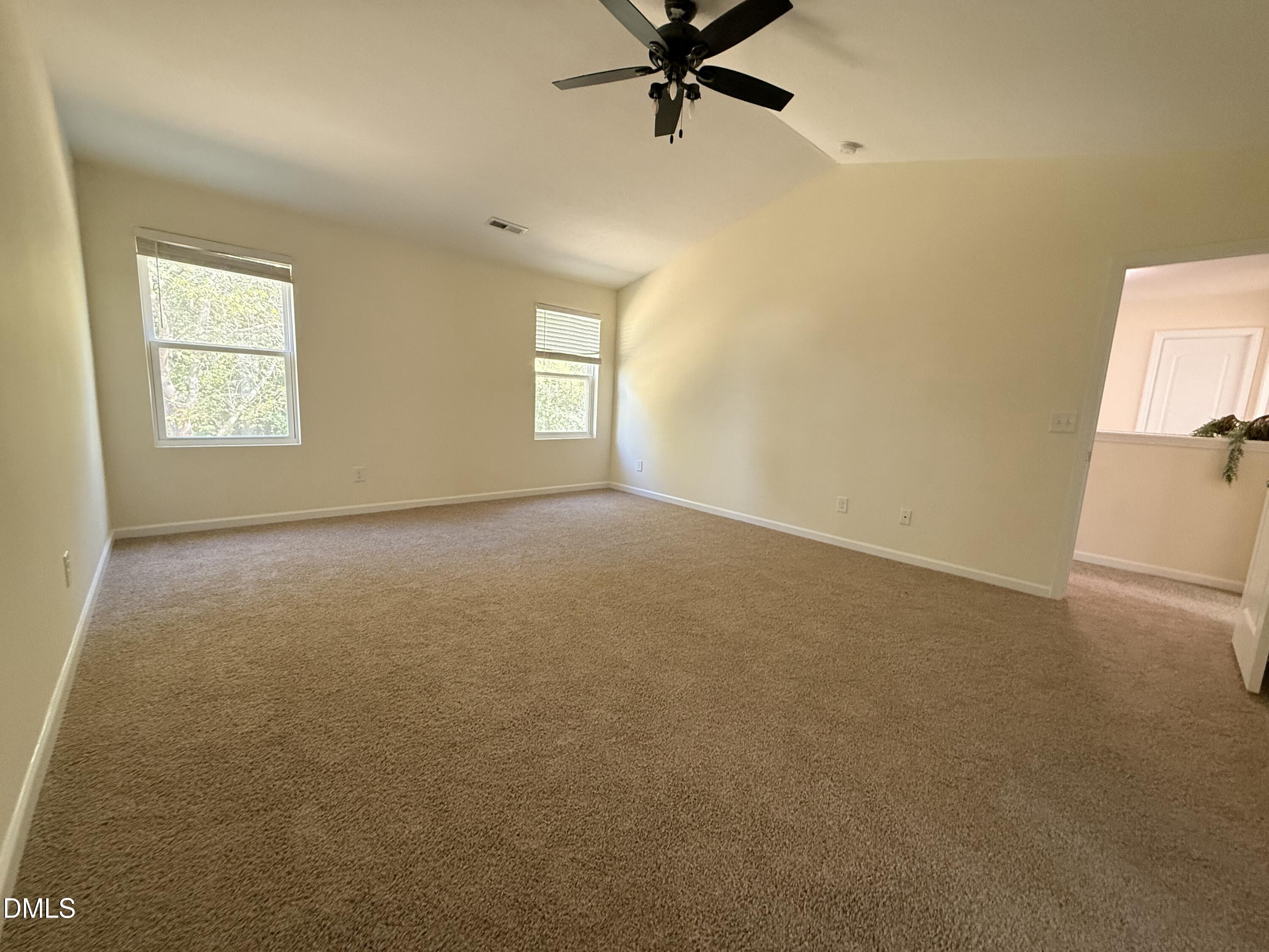 62 West Boulder Road Henderson, NC 27537 - Photo 27 of 34 an empty room with a window and a fan