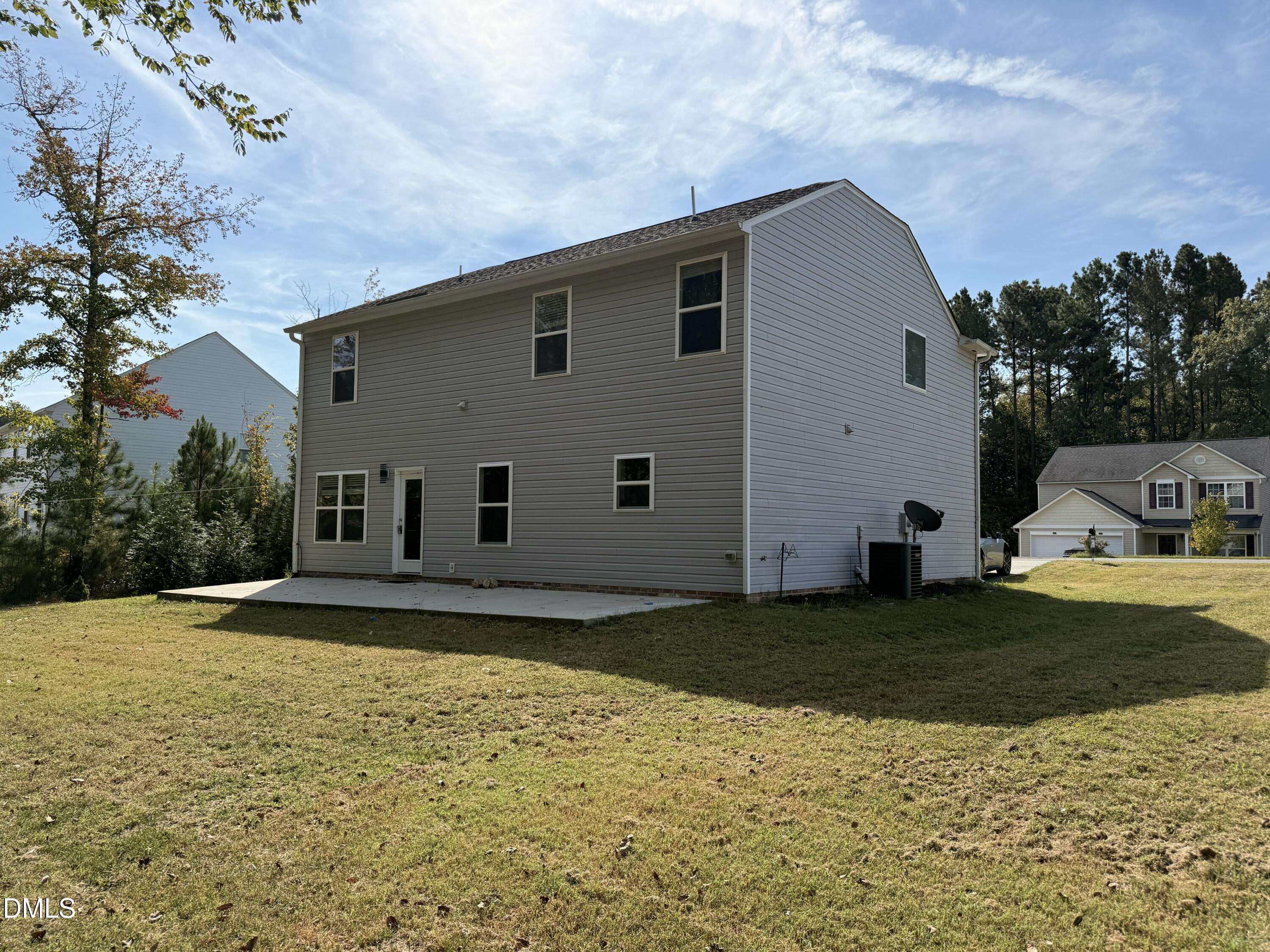 62 West Boulder Road Henderson, NC 27537 - Photo 33 of 34 a view of a house with a yard