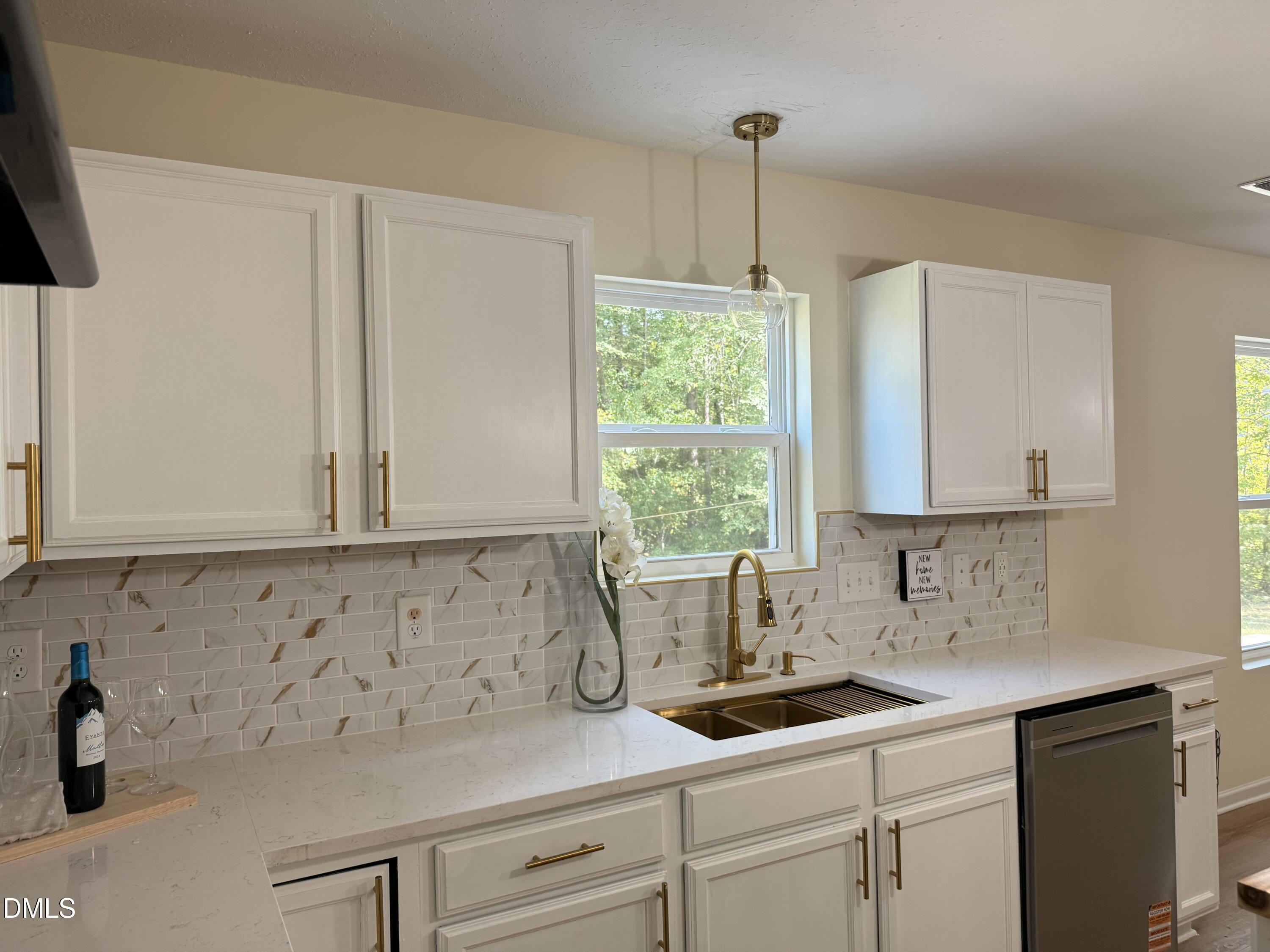 62 West Boulder Road Henderson, NC 27537 - Photo 8 of 34 a kitchen with a sink and cabinets