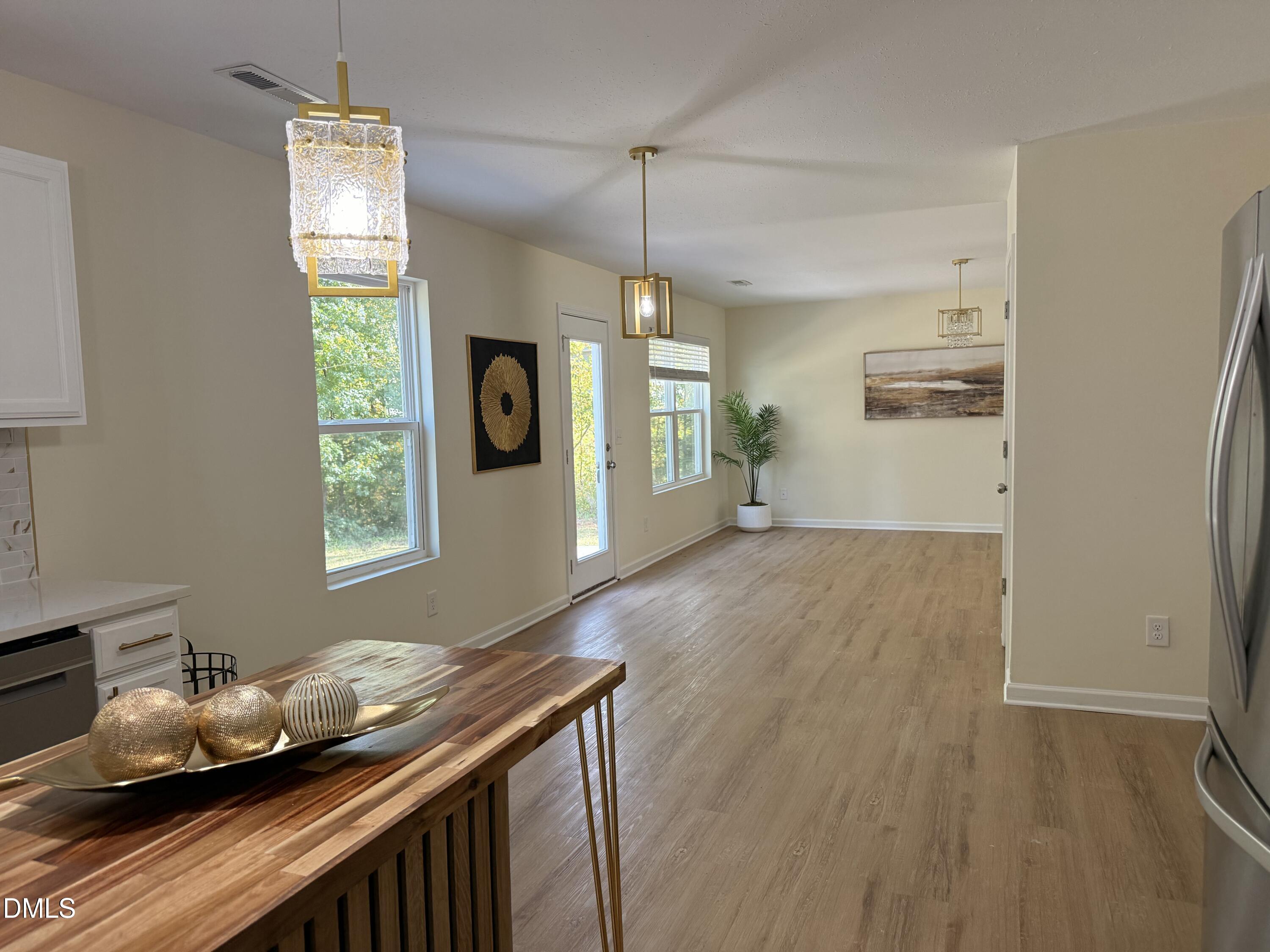 62 West Boulder Road Henderson, NC 27537 - Photo 10 of 34 a hallway with furniture and window
