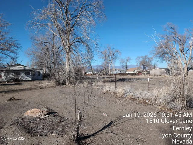 a view of lake with a yard