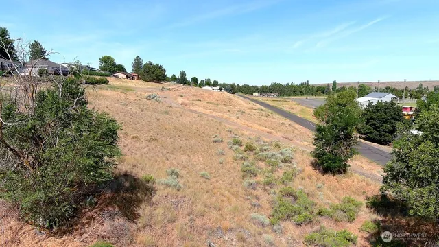 a view of a lake with beach and city view