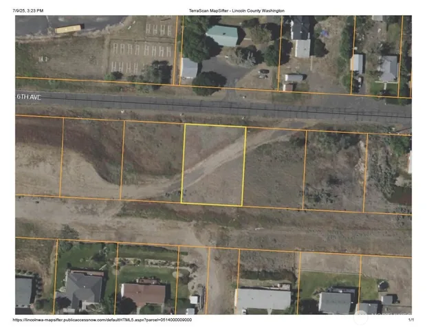 an aerial view of a residential houses with outdoor space