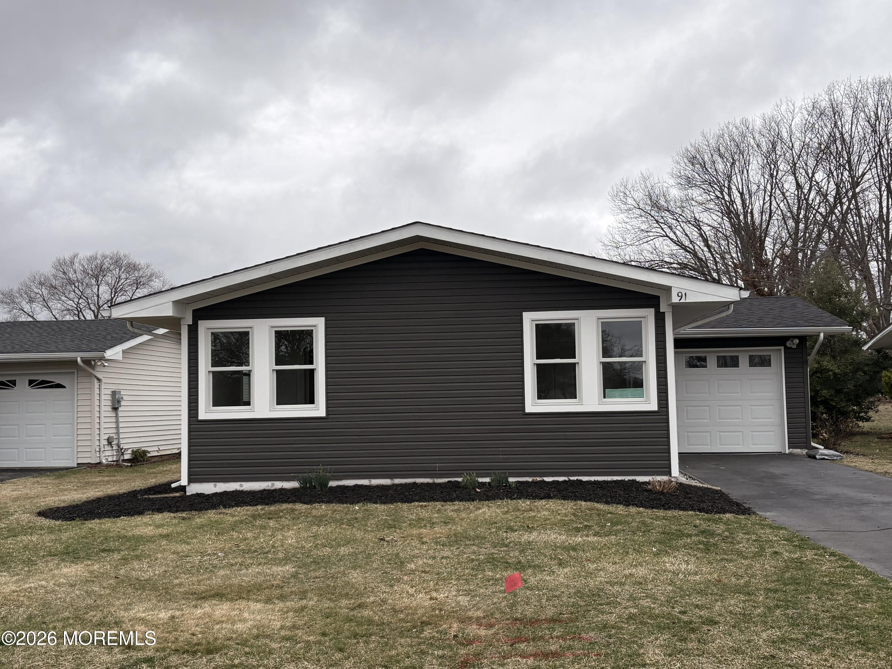 a house that has a large window in front of it