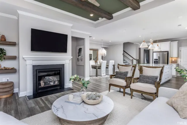 a living room with furniture fireplace and flat screen tv