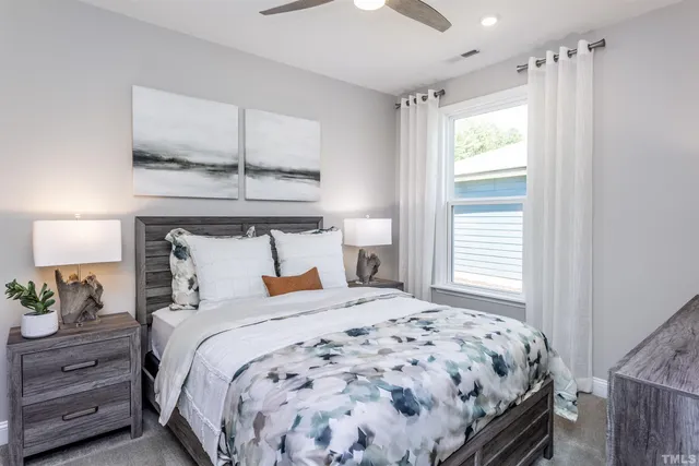 a bedroom with a bed and a window