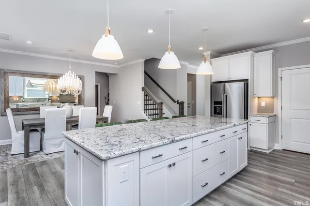 a kitchen with a table and chairs in it