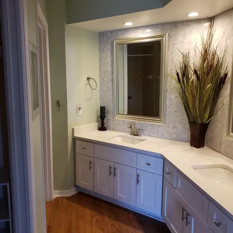 a room with wooden floor and furniture