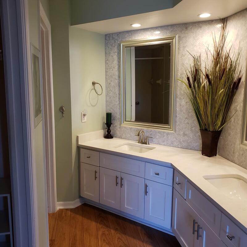 6021 Southeast Landing Way, Unit BLDG 2 #2 Stuart, FL 34997 - Photo 18 of 35 a bathroom with a sink and a mirror