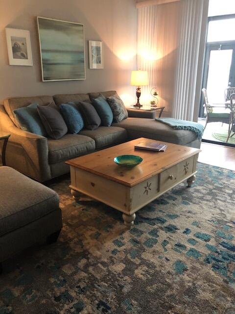 6021 Southeast Landing Way, Unit BLDG 2 #2 Stuart, FL 34997 - Photo 21 of 35 a living room with furniture and a large window